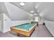 This game room features a pool table, foosball table, and ample space for entertainment at 4420 Dula St, Durham, NC 27705