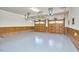 Spacious three car garage with epoxy floors, wood paneling, and ample storage at 4420 Dula St, Durham, NC 27705
