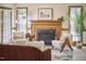 Charming living room featuring a brick fireplace and cozy furniture arrangement at 4420 Dula St, Durham, NC 27705