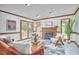 Cozy living room with a fireplace and comfortable seating at 4420 Dula St, Durham, NC 27705