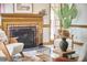 Close-up view of a living room fireplace with decorative accents and modern seating at 4420 Dula St, Durham, NC 27705