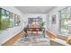 Bright and airy office space featuring a wooden desk, bookshelf, and natural light from a window at 4420 Dula St, Durham, NC 27705