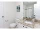 Bathroom featuring a white vanity with granite countertop and a framed mirror at 4913 Stockton Way, Durham, NC 27707