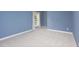 Bedroom featuring neutral carpet, natural light and light blue walls at 4913 Stockton Way, Durham, NC 27707