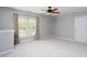 Neutral bedroom featuring neutral carpet, ceiling fan and bright natural light at 4913 Stockton Way, Durham, NC 27707