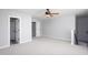 Neutral bedroom featuring neutral carpet, ceiling fan and bright natural light at 4913 Stockton Way, Durham, NC 27707