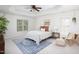 Bedroom with tray ceiling, neutral walls, plush carpet, area rug and windows at 4913 Stockton Way, Durham, NC 27707