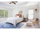 Bedroom with tray ceiling, neutral walls, plush carpet, area rug and windows at 4913 Stockton Way, Durham, NC 27707