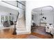 Open foyer with staircase leading to the second floor and views of the living spaces at 4913 Stockton Way, Durham, NC 27707