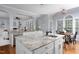 Kitchen featuring island with seating, granite countertops, and stainless steel dishwasher at 4913 Stockton Way, Durham, NC 27707