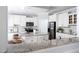 Well-appointed kitchen with stainless steel appliances, granite counters, and white cabinets at 4913 Stockton Way, Durham, NC 27707
