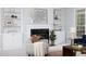 Bright living room with a black marble fireplace and white built-in shelves at 4913 Stockton Way, Durham, NC 27707