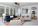 Sunlit living room with an open layout and views into the kitchen at 4913 Stockton Way, Durham, NC 27707
