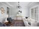 Elegant living room with hardwood floors, comfortable seating, and a decorative chandelier at 4913 Stockton Way, Durham, NC 27707