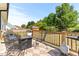 Spacious back deck with a fire pit, seating, and space for outdoor dining and relaxation at 50 Waterford Dr, Angier, NC 27501