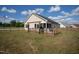 A charming single-story home featuring a delightful back deck and screen porch for enjoying the backyard at 50 Waterford Dr, Angier, NC 27501