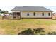 Image of the green backyard and the back of the home at 50 Waterford Dr, Angier, NC 27501