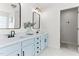 Stylish bathroom featuring double sinks with marble countertops and light blue cabinets at 50 Waterford Dr, Angier, NC 27501