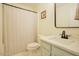 Bright bathroom with a clean vanity, toilet, and a stylish shower curtain at 50 Waterford Dr, Angier, NC 27501
