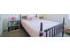 Bright bedroom featuring a cute bed, bookshelves, and ample natural light at 50 Waterford Dr, Angier, NC 27501