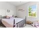 Cozy bedroom with adorable decor, natural light, and plush bedding at 50 Waterford Dr, Angier, NC 27501
