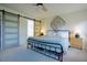 Airy bedroom with large windows, sliding doors, and comfortable bed at 50 Waterford Dr, Angier, NC 27501