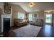 Inviting living room features vaulted ceilings, fireplace, and two comfortable sofas at 50 Waterford Dr, Angier, NC 27501