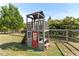 Two story backyard playhouse features a slide, ladders, and a shaded play area at 50 Waterford Dr, Angier, NC 27501