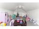 Bright playroom featuring a ceiling fan, furniture, and cozy carpet at 50 Waterford Dr, Angier, NC 27501