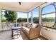 Relaxing screened porch featuring a comfortable wicker sofa and neutral color scheme at 50 Waterford Dr, Angier, NC 27501