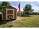 Storage shed in the backyard with barn doors, perfect for storing your gardening tools and equipment at 50 Waterford Dr, Angier, NC 27501