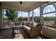 Relaxing sunroom with comfortable seating and views of the backyard at 50 Waterford Dr, Angier, NC 27501