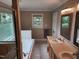 The bathroom features a soaking tub, stand up shower and double sink vanity at 501 Samara St, Apex, NC 27502