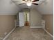 Attic bedroom with plush carpet, base trim and additional storage with an open door to a hall at 501 Samara St, Apex, NC 27502