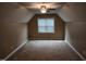 Cozy bedroom features neutral paint and carpet, a window, and a ceiling fan at 501 Samara St, Apex, NC 27502