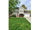 Charming two-story home with a well-manicured lawn and a welcoming red front door at 501 Samara St, Apex, NC 27502