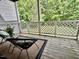 Inviting back porch features outdoor seating, with privacy and a pleasant view at 503 Gooseneck Drive # B4, Cary, NC 27513