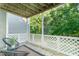 Cozy back porch with outdoor seating and a view of the lush yard at 503 Gooseneck Drive # B4, Cary, NC 27513
