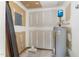 Unfinished basement with hot water tank ready for customization and ample storage at 503 Gooseneck Drive # B4, Cary, NC 27513