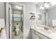 Bathroom features white cabinets, granite countertops, and a glass door shower at 503 Gooseneck Drive # B4, Cary, NC 27513