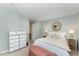 Serene bedroom with a plush bed, stylish dresser, soothing colors, and ample storage at 503 Gooseneck Drive # B4, Cary, NC 27513