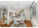 Dining area with a round table, modern chairs, stylish lighting, and ample natural light at 503 Gooseneck Drive # B4, Cary, NC 27513