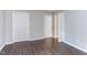 Bedroom with modern floors, closet doors, and neutral walls at 600 Audubon Lake Dr # 6B13, Durham, NC 27713