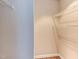 Walk-in closet featuring white wire shelving and laminate floors at 600 Audubon Lake Dr # 6B13, Durham, NC 27713