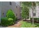 Exterior view of the building with lush green trees and manicured landscape at 600 Audubon Lake Dr # 6B13, Durham, NC 27713