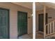 Exterior entry with green doors and a light covered entryway at 600 Audubon Lake Dr # 6B13, Durham, NC 27713