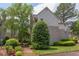 The exterior shows a well maintained building with trees and shrubbery, plus a fire hydrant at 600 Audubon Lake Dr # 6B13, Durham, NC 27713