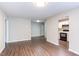 Open living room space featuring updated flooring and connection to the modern kitchen at 600 Audubon Lake Dr # 6B13, Durham, NC 27713