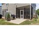 Well-maintained backyard featuring a screened porch, grill, and outdoor seating area at 609 Woodson Dr, Clayton, NC 27527