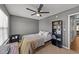 Comfortable bedroom featuring a ceiling fan, neutral colors, and ample space for relaxation and study at 609 Woodson Dr, Clayton, NC 27527